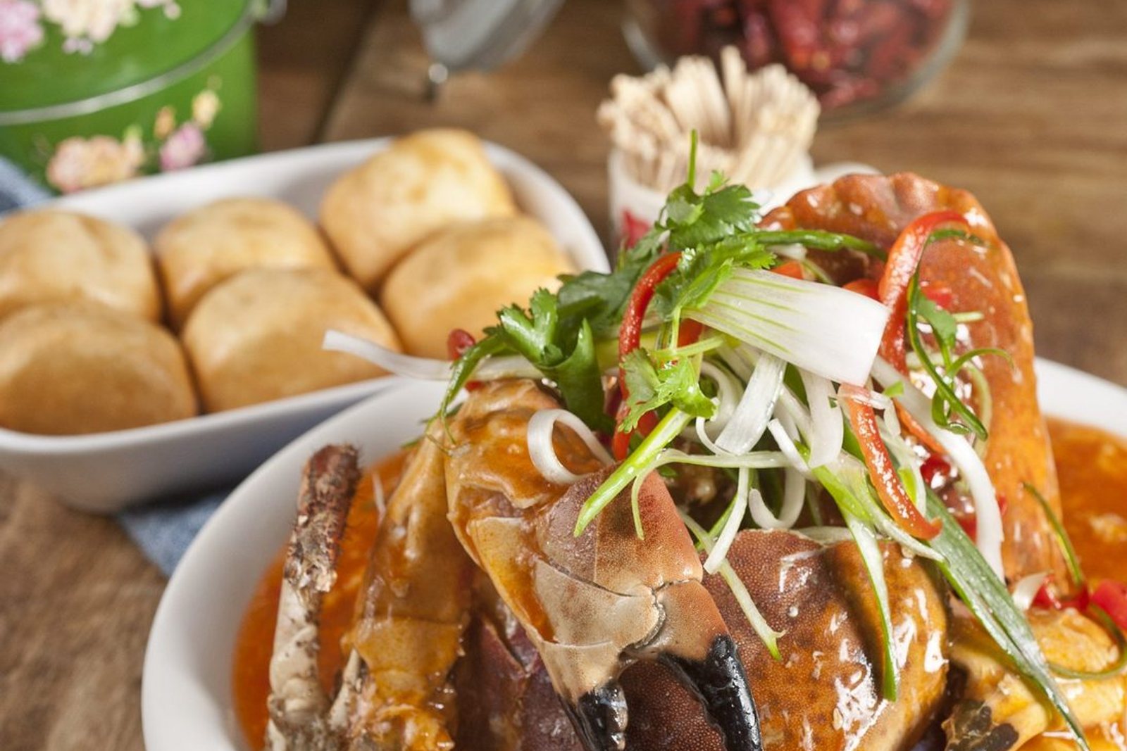 A spread of wok-cooked Straits dishes on the table at Rasa Sayang.